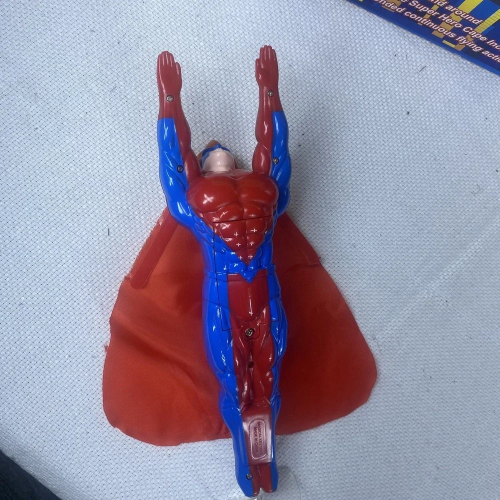Flying Super Hero Action Figure Toy Battery Operated Cape Included Spins In Air